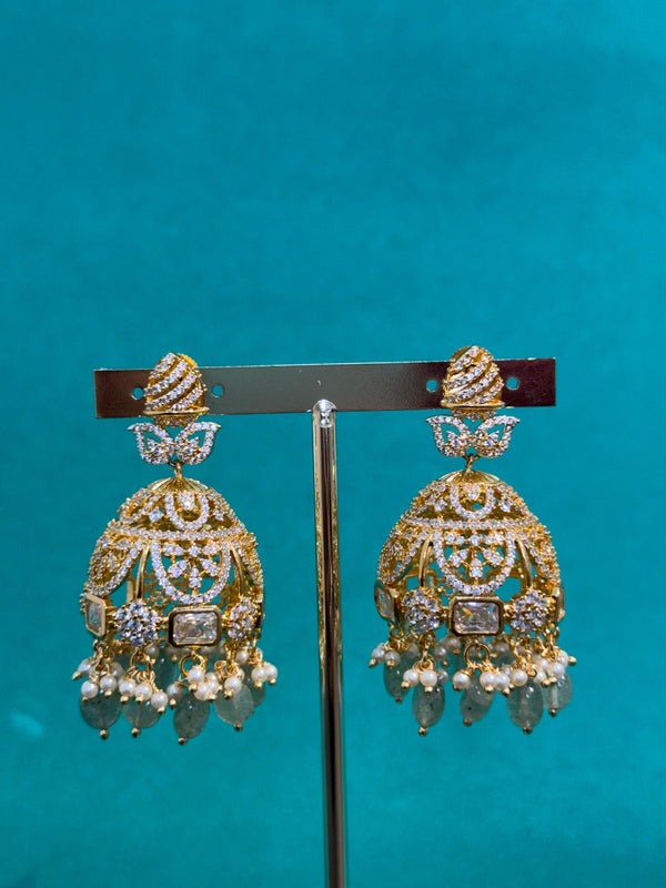 TRENDING JHUMKA'S IN PREMIUM BRASS MATERIAL WITH CUBIC ZIRCONIA STONES AND NATURAL STRAWBERRY BEADS