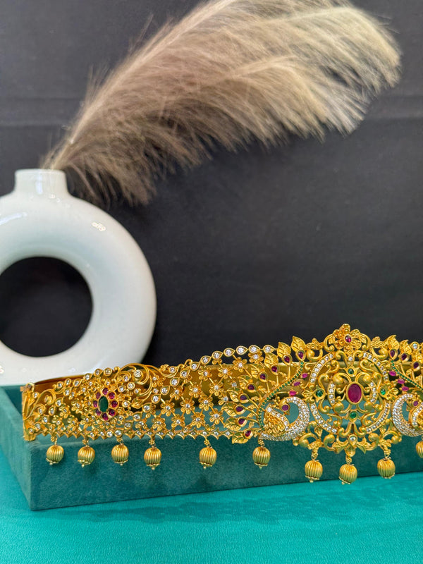 TRENDING PEACOCK VADDANAM IN PREMIUM BRASS MATERIAL WITH GOLD POLISH IN FREE SIZE