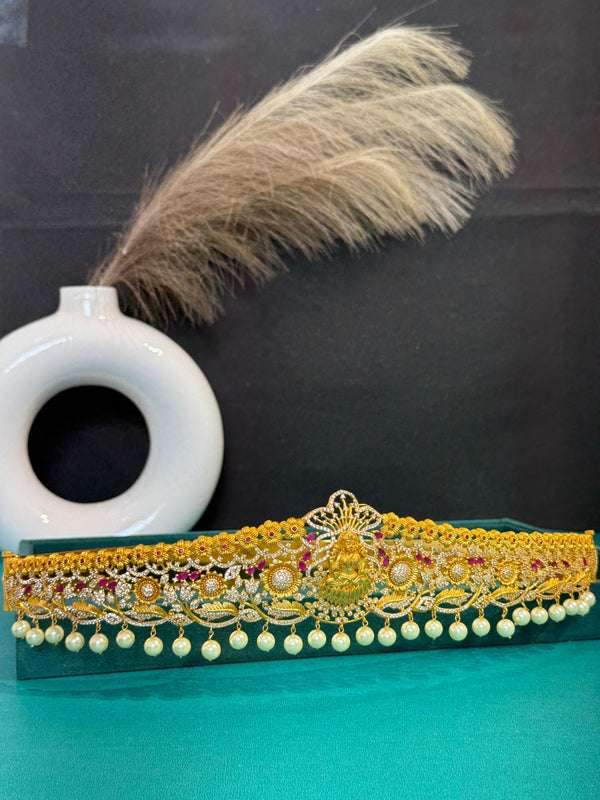 TRENDING LAXMI VADDANAM IN GOLD POLISH AND CUBIC ZIRCONIA STONES AND IMITATION GLASS PALACE FALL