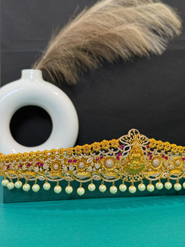 TRENDING LAXMI VADDANAM IN GOLD POLISH AND CUBIC ZIRCONIA STONES AND IMITATION GLASS PALACE FALL